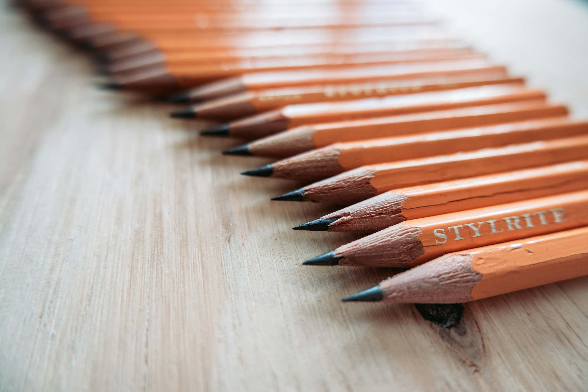 From Diamonds to pencils Coidan Graphite Blog Image Picture of pencils lined up on a wooden countertop