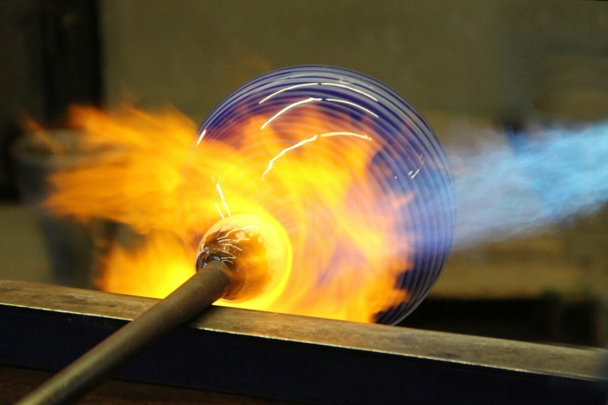 Graphite and Carbon uses n the Glass and Cramics Industry Coidna Graohic Blog image of glass blowing with a glass sphere on a rod